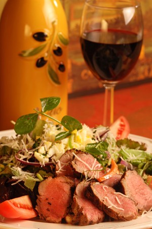 Tabasco Chipotle Veal Tenderloin Salad with Sartori Asiago Cheese background image