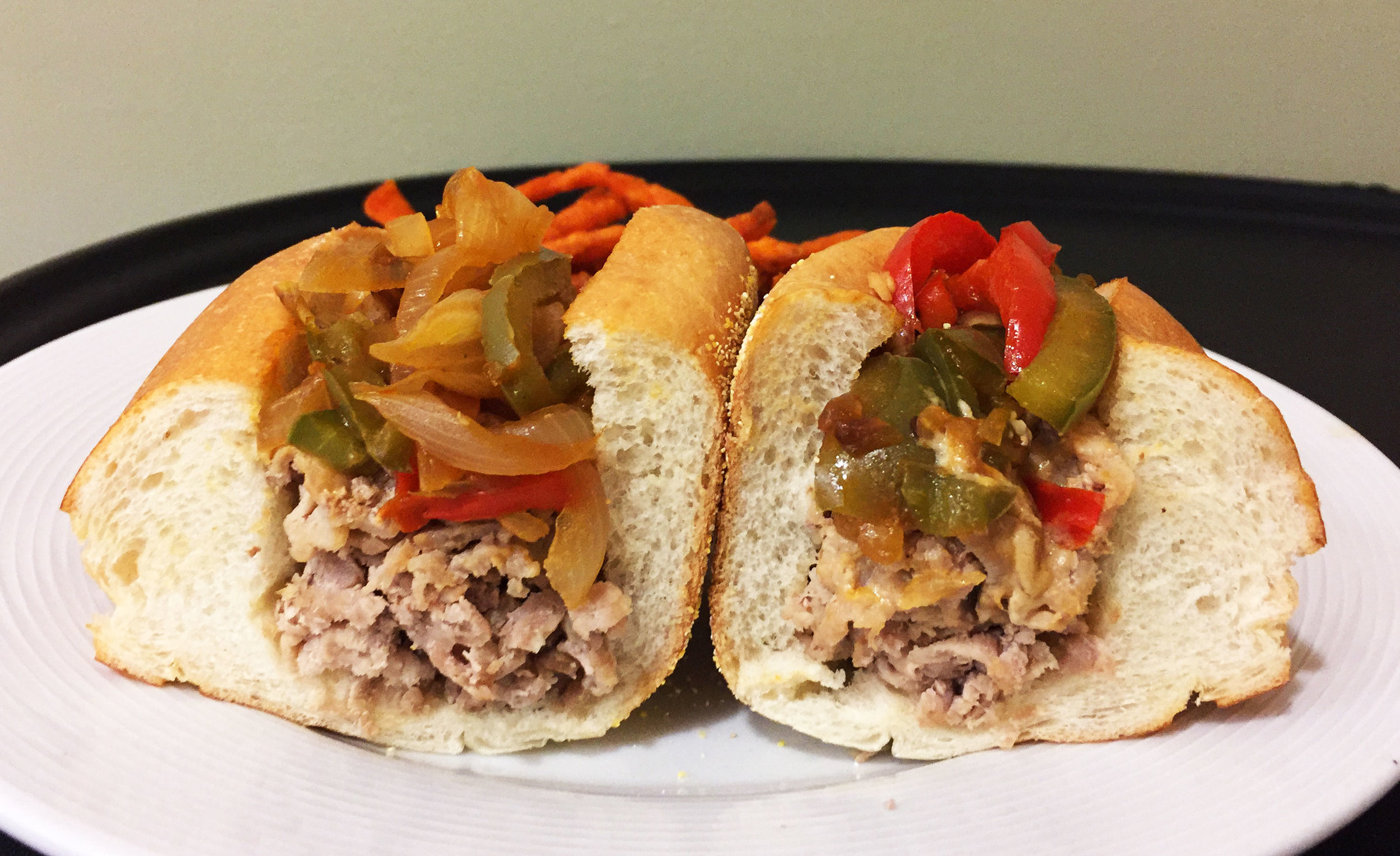 Shaved veal steak sandwich with sautéed peppers and onions