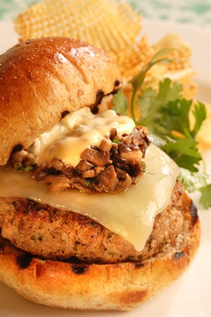 Veal Steak Burger with Tabasco Chipotle Pepper Sauce background image