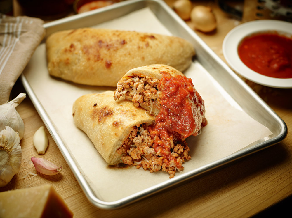 Veal Calzone dipped in marinara