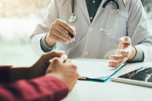 Doctor talking to the patient about treatment in future.