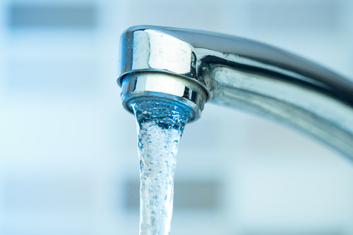 Pouring water from a Faucet