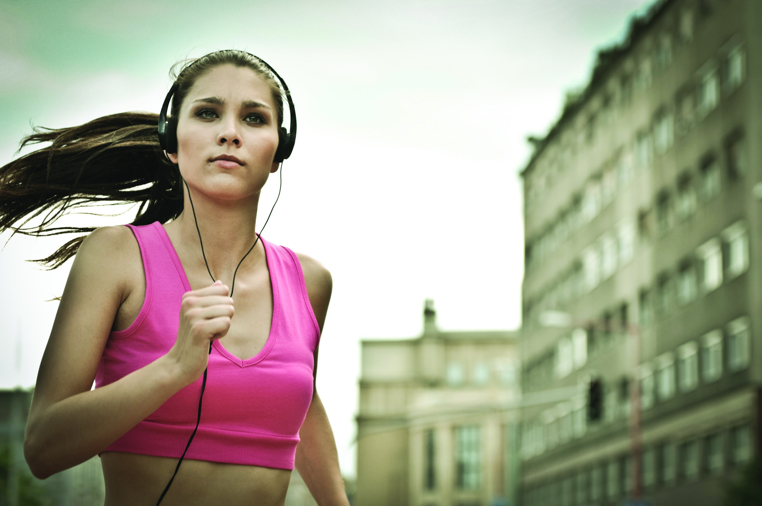 Girl running with headphones
