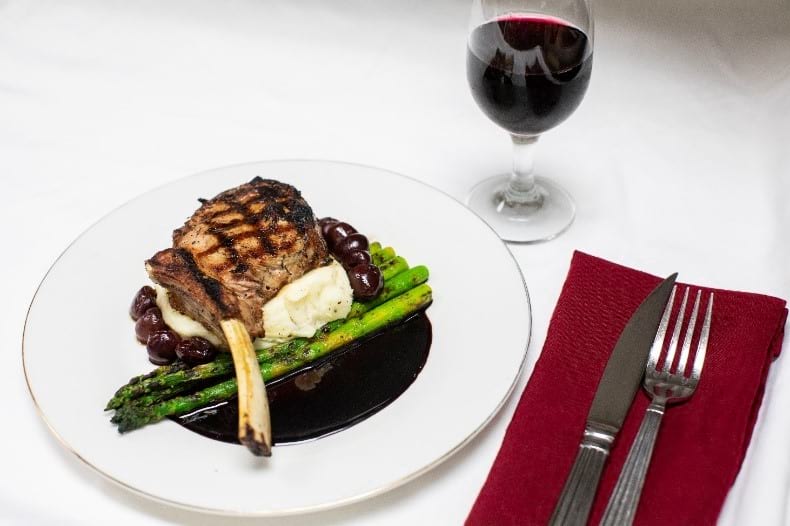 These Grilled Veal Chops with a Cherry Agrodolce are served over mashed potatoes and asparagus with the agrodolce sauce to finish the plate.