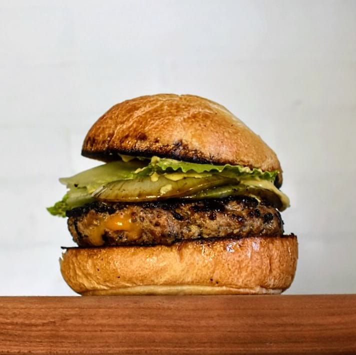 Smokey Garlic and Cheddar Stuffed Burger background image