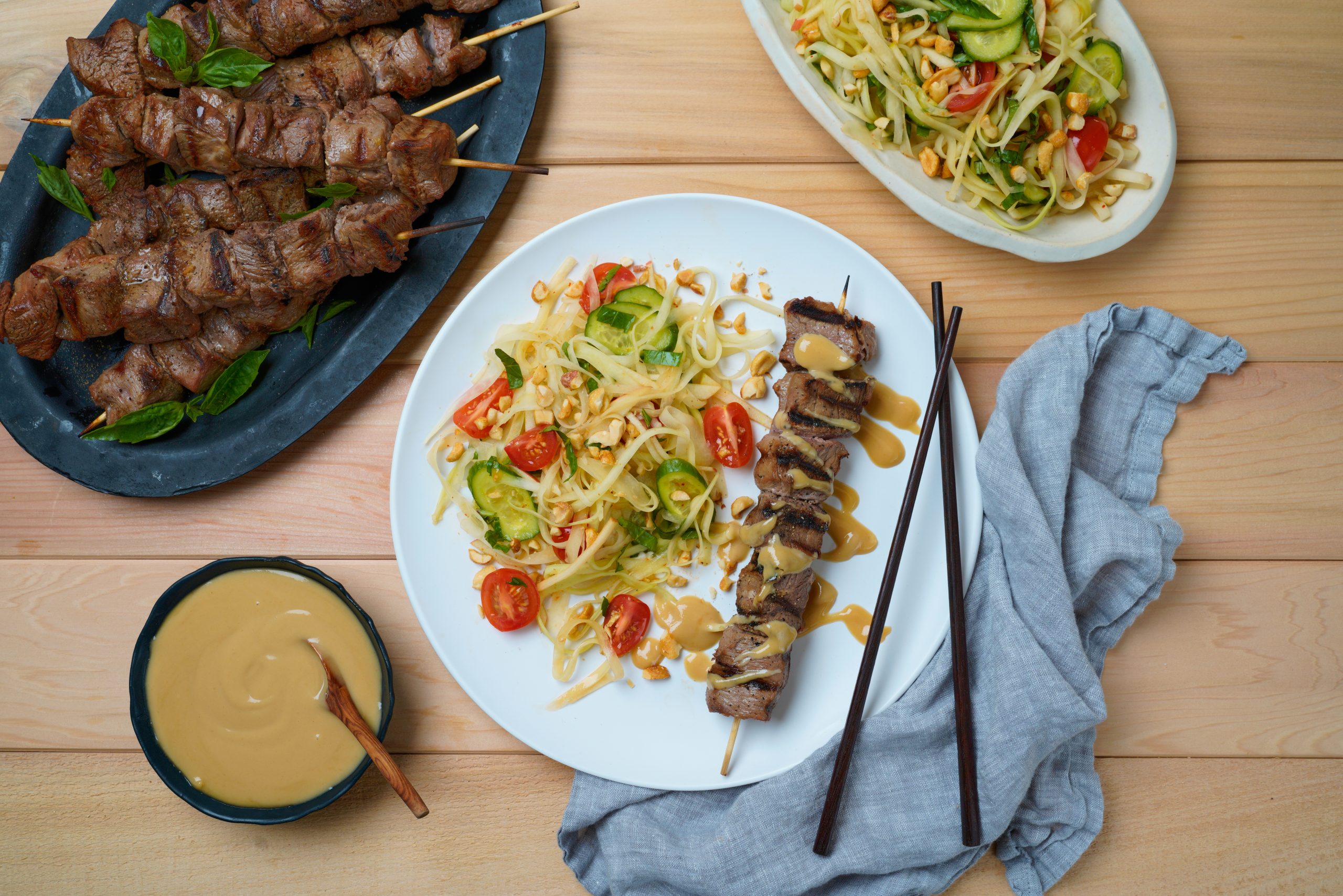 A Tahini Satay and Papaya Salad that will leave you feeling like summer just got a little bit closer no matter what time of year.