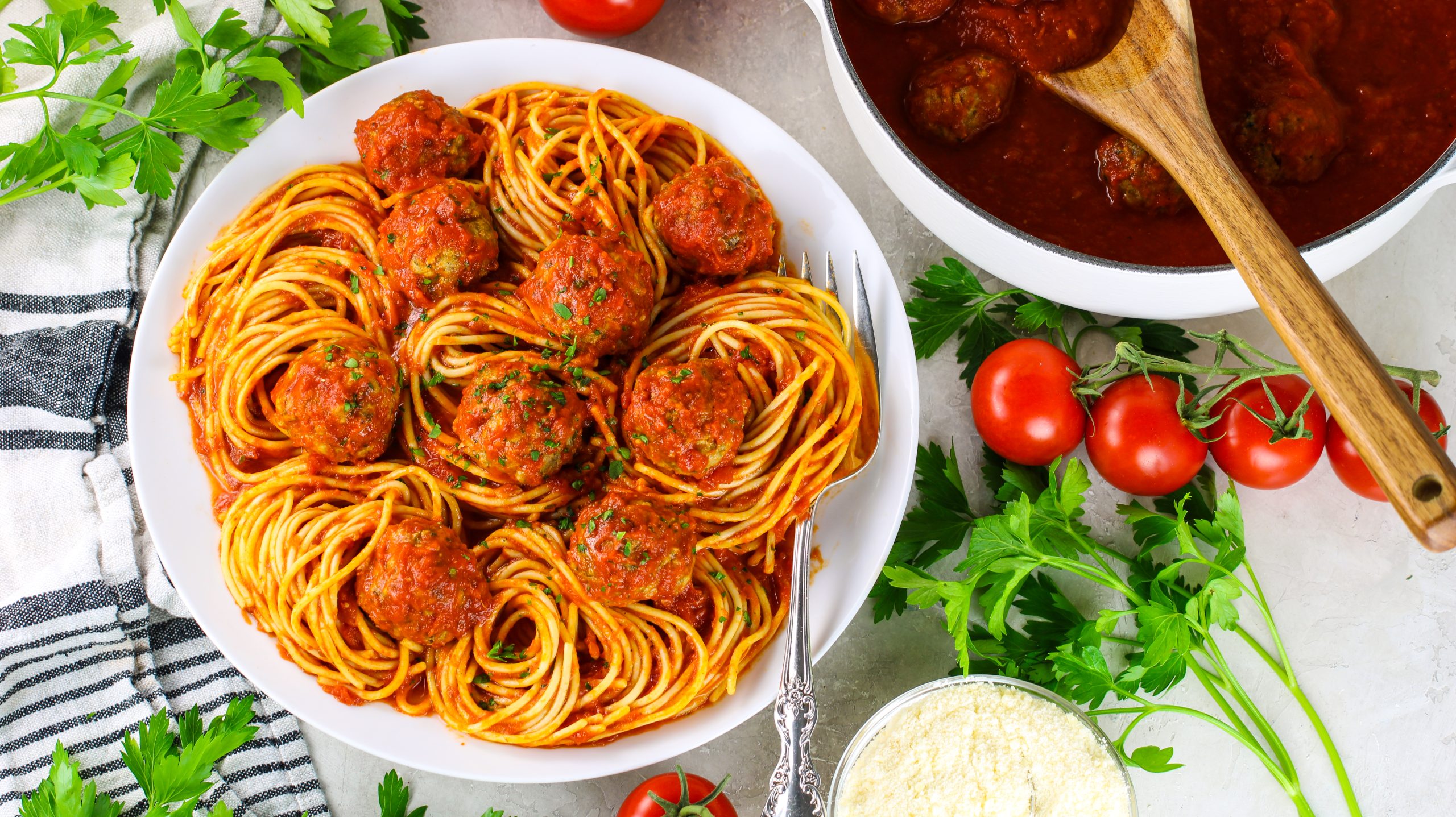 Classic meatballs in a bed or spiral pasta with red sauce